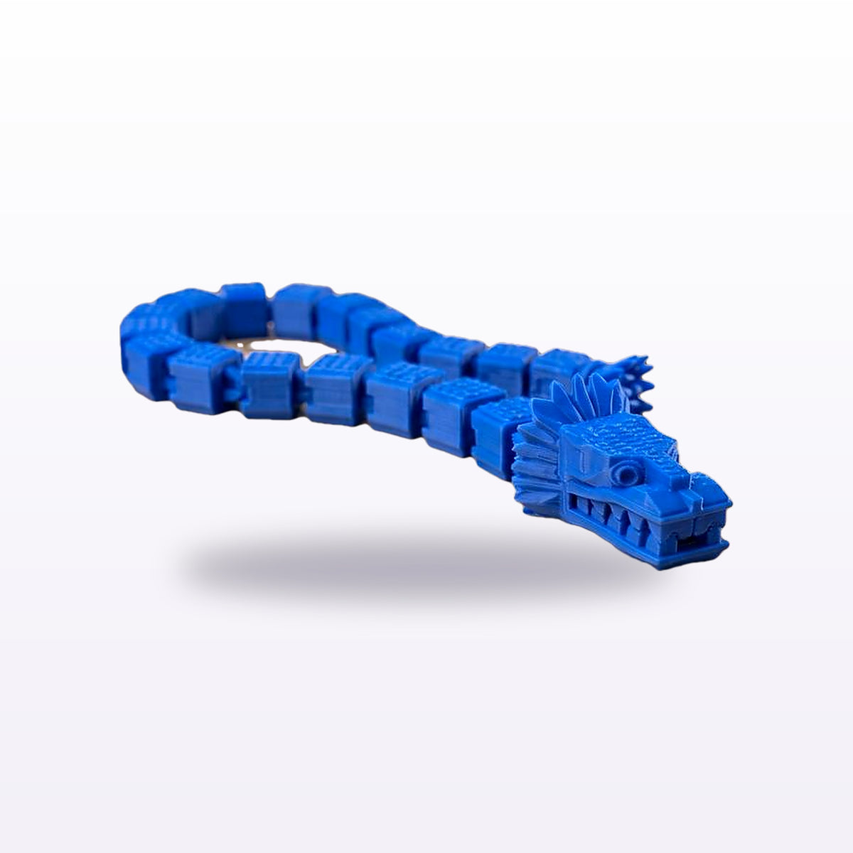 Large flexi dragon in blue, coiled